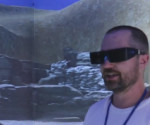 view of Dave wearing shutter glasses, with virtual dig site in the background